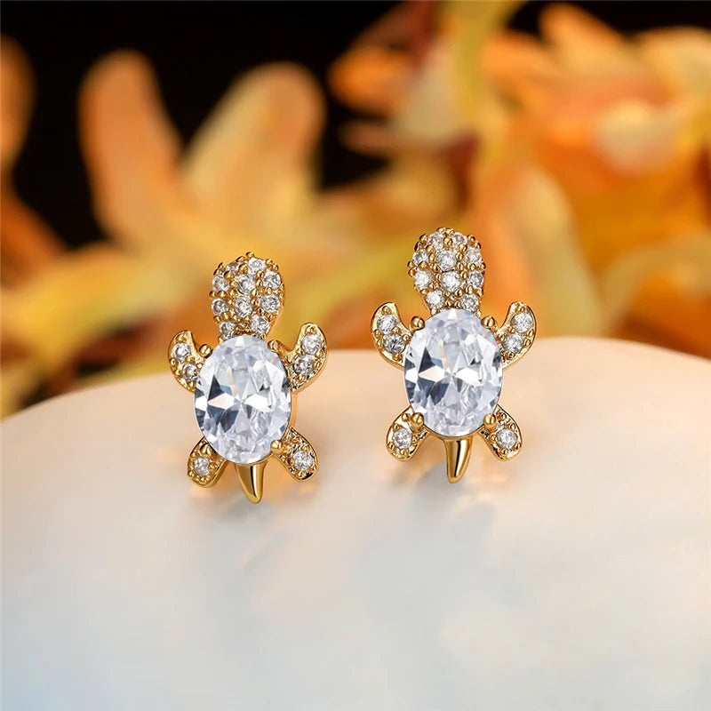 Starlight Glow Turtle Stud Earrings – White Crystal with Gold Finish