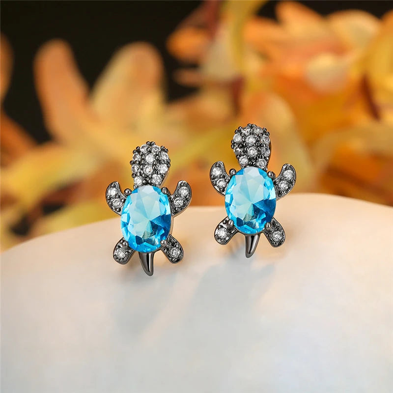Midnight Tide Turtle Stud Earrings – Aqua Blue Sparkle in Black Gold